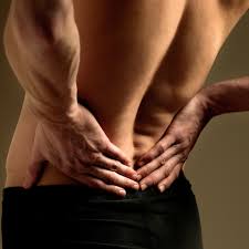 Person experiencing lower back pain