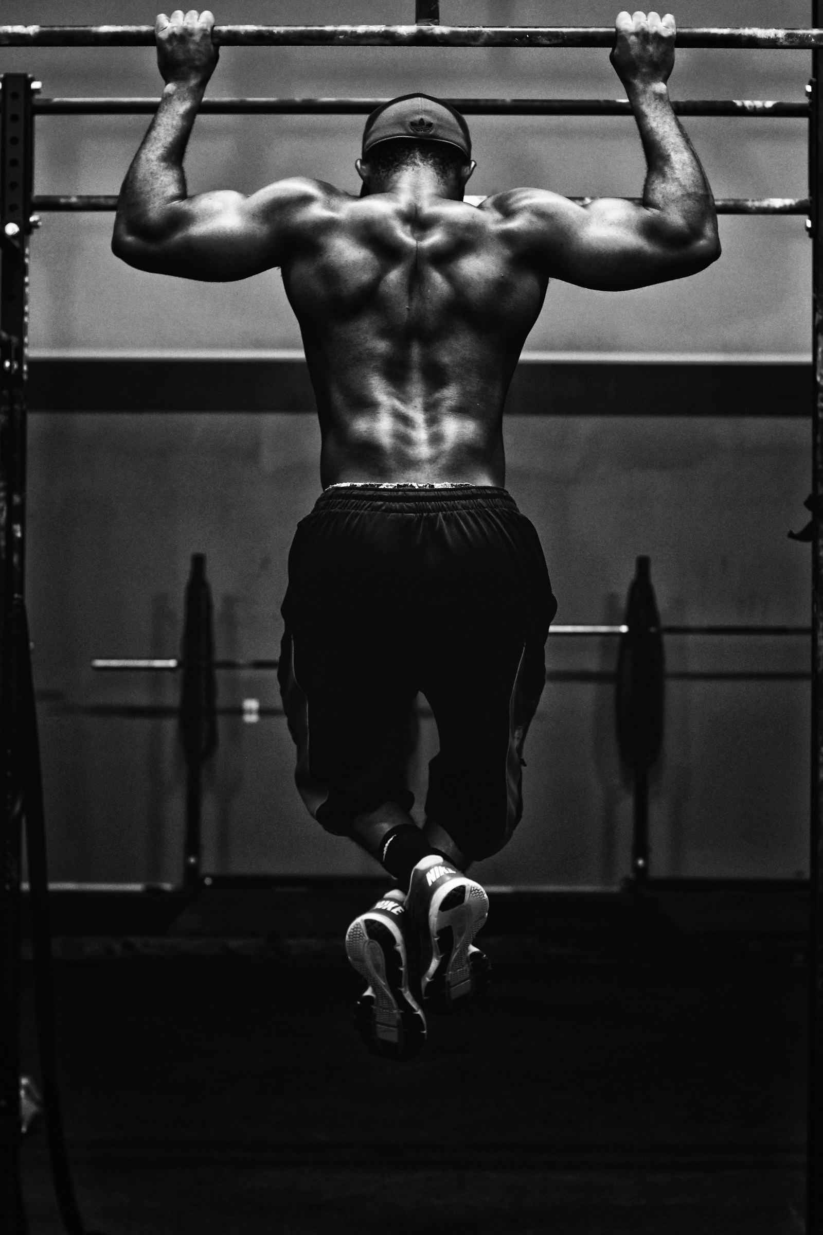 Personal trainer guiding a beginner through a gym exercise