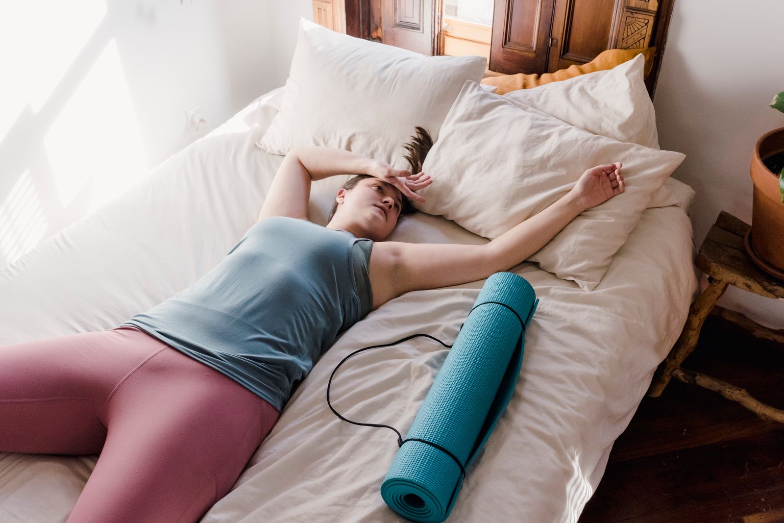 Recovery routine with sleep mask, book, foam roller, and training shoes